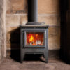 ESSE Warmheart in a large stone fireplace